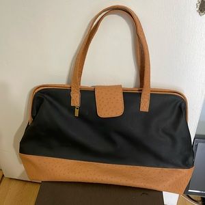 Elizabeth Arden black & tan large canvas and faux leather tote bag.